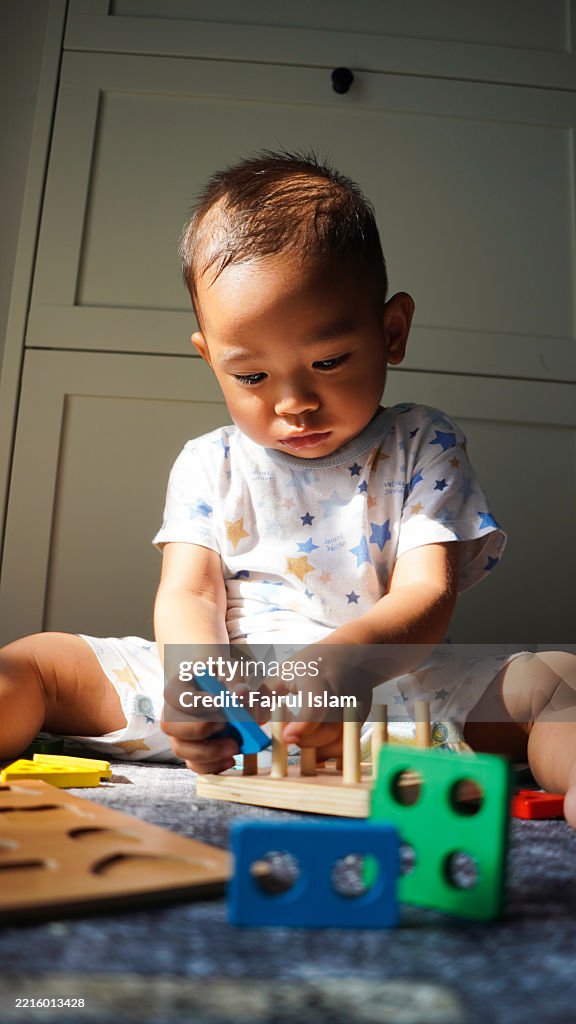 Toddler playing with educational toys