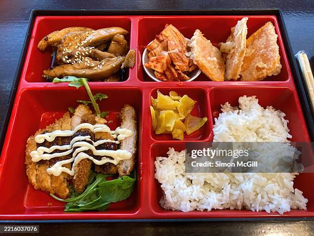 bento box with teriyaki chicken, kimchi, tempura pumpkin, pork tonkatsu, pickled radish and rice - bento box stock pictures, royalty-free photos & images