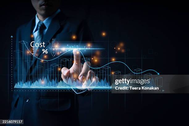 cost and quality control, business analyst interacting with a holographic cost percentage chart above a tablet to evaluate financial performance - cost analysis stock pictures, royalty-free photos & images