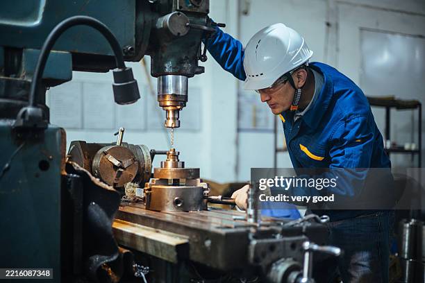 asian male engineer working on lathe - cnc operator stock pictures, royalty-free photos & images