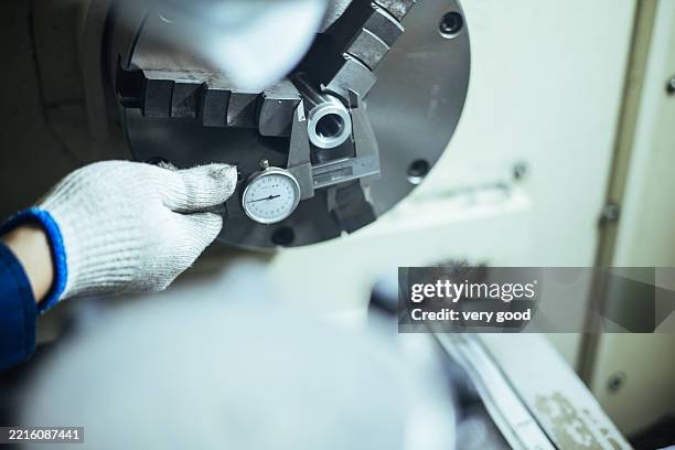 mechanic in workshop using caliper - precision calipers stock pictures, royalty-free photos & images