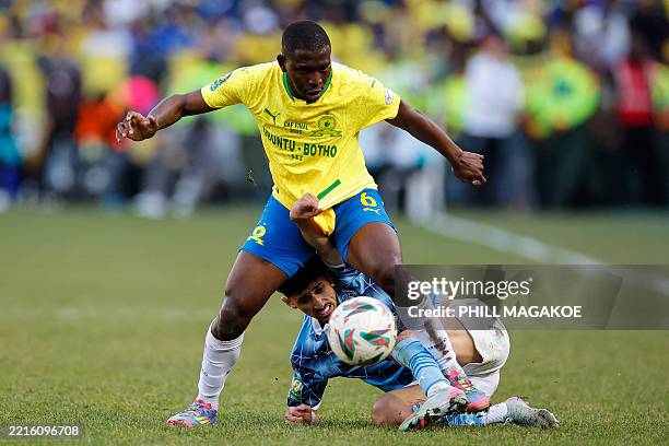 Pyramids' Egyptian midfielder Ahmed Atef fights for the ball under Sundowns' South African defender Aubrey Modiba during the first leg of the CAF...