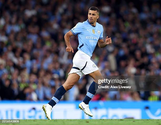 Rodri of Manchester City looks on as he runs off the ball after coming on as a substitute having returned from a long-term injury during the Premier...