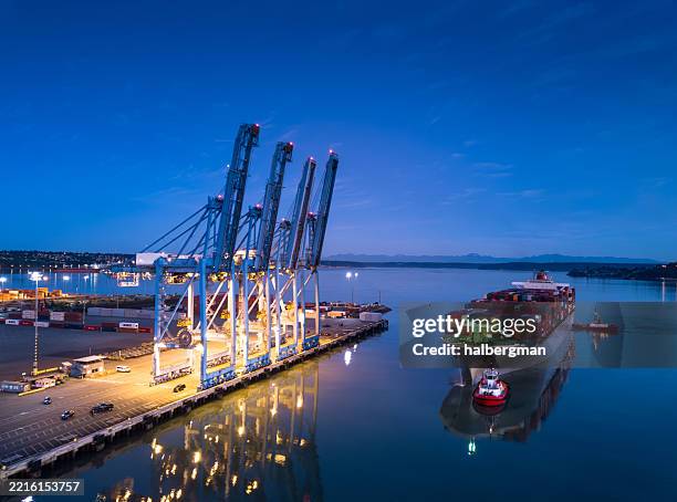 cargo ship carrying containers on blair waterway parked at container terminal in tacoma, wa - port blair stock pictures, royalty-free photos & images