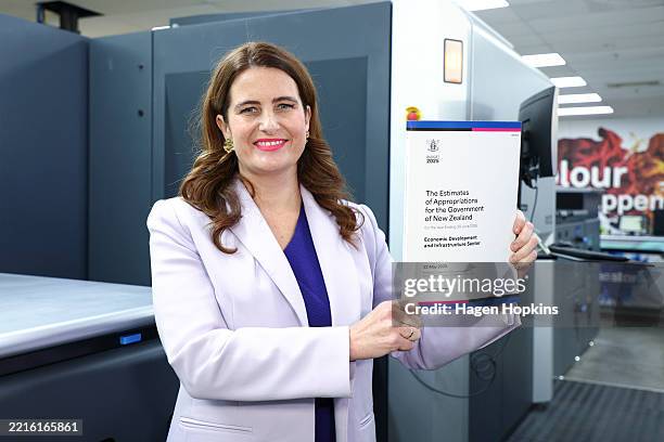 Finance Minister Nicola Willis poses with a copy of Budget 2025 during the printing of the budget at Blue Star on May 21, 2024 in Wellington, New...