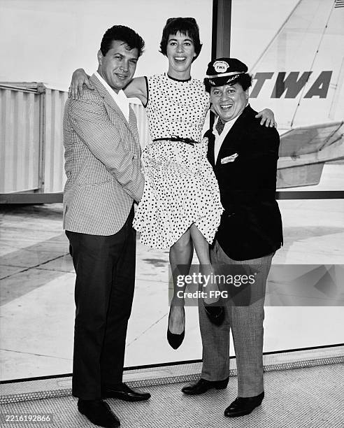 American comedian and singer Steve Rossi, American comedian and actress Carol Burnett, and American comedian and actor Marty Allen, who wears a TWA...