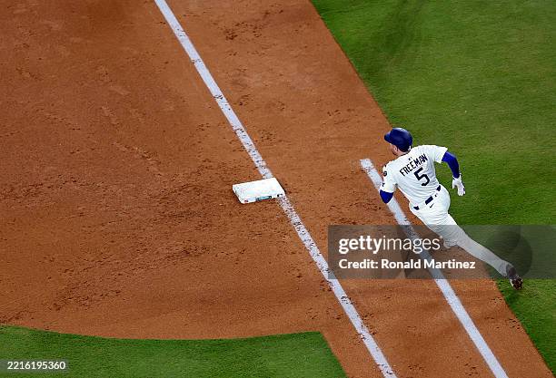 Freddie Freeman of the Los Angeles Dodgers runs after hitting a double against the Arizona Diamondbacks in the fourth inning at Dodger Stadium on May...