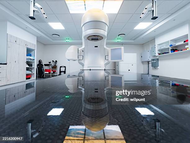 modern medical facility with advanced radiotherapy equipment for cancer treatment - particle accelerator stock pictures, royalty-free photos & images
