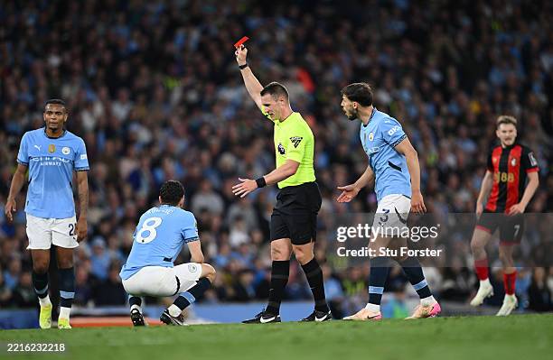 Referee Thomas Bramall shows a red card to send off Manchester City player Mateo Kovacic during the Premier League match between Manchester City FC...