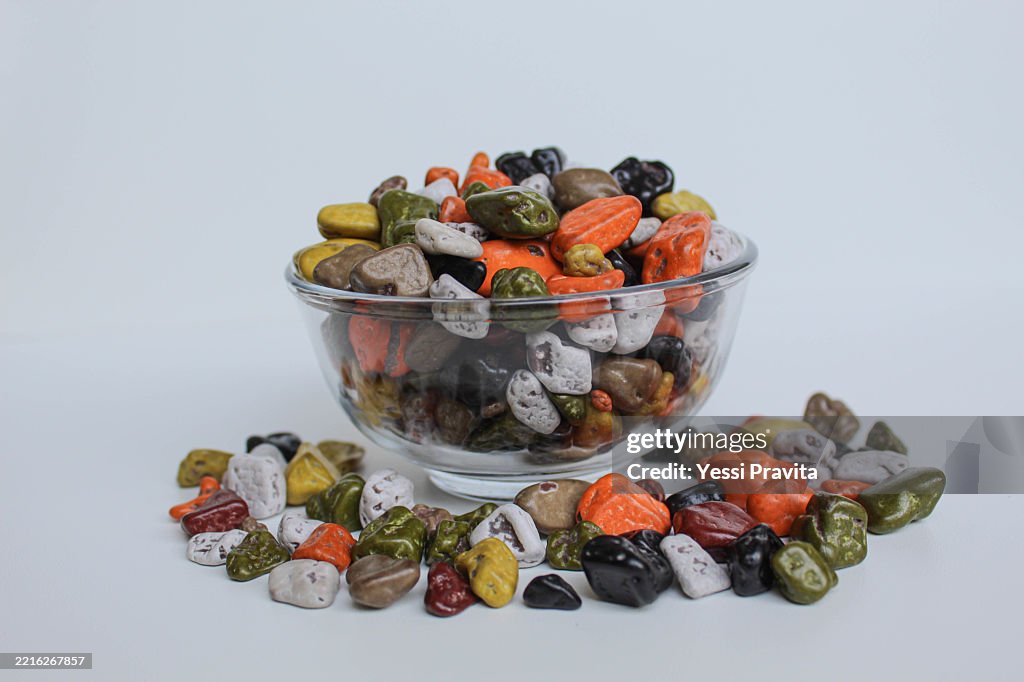Turkish stone chocolate, in transparent bowl, isolated on white background
