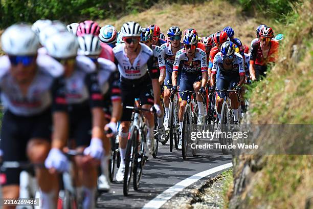 Giulio Pellizzari of Italy, Primoz Roglic of Slovenia and Daniel Felipe Martinez of Colombia and Team Red Bull - BORA - hansgrohe compete during the...