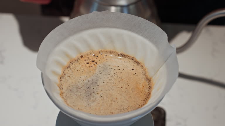 https://media.gettyimages.com/id/2216284176/video/close-up-to-barista-brewing-coffee-with-v60-dripper.jpg?b=1&s=640x640&k=20&c=7kA7UshkDOOZHcr0zriPIhfMbFsQDEKNzIkvDfqK_I4=