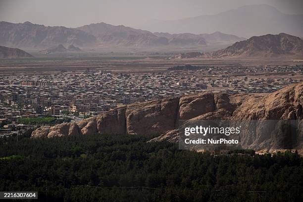 View of a forested slope and the city of Kerman, 1335 km southeast of Tehran, Iran, on May 21, 2025.