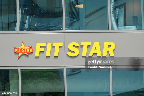 Close-up view of the FIT STAR gym logo is mounted on the exterior facade of the fitness center in Munich, Bavaria, Upper Bavaria, Germany, on May 24,...