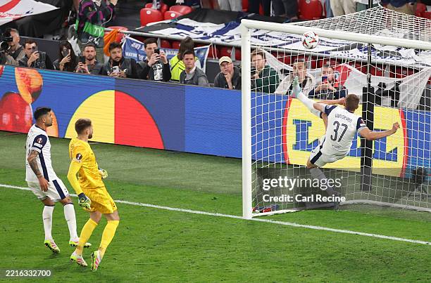 Micky van de Ven of Tottenham Hotspur makes a goal-line clearance after a header from Rasmus Hojlund of Manchester United during the UEFA Europa...