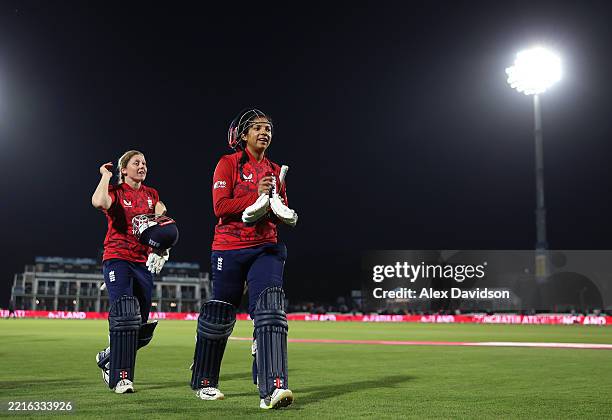 Sophia Dunkley and Heather Knight of England celebrate victory during the 1st Women's Vitality IT20 between England and West Indies at The Spitfire...