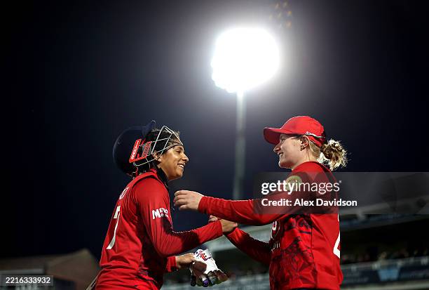 Sophia Dunkley celebrates with Charlie Dean after the 1st Women's Vitality IT20 between England and West Indies at The Spitfire Ground on May 21,...