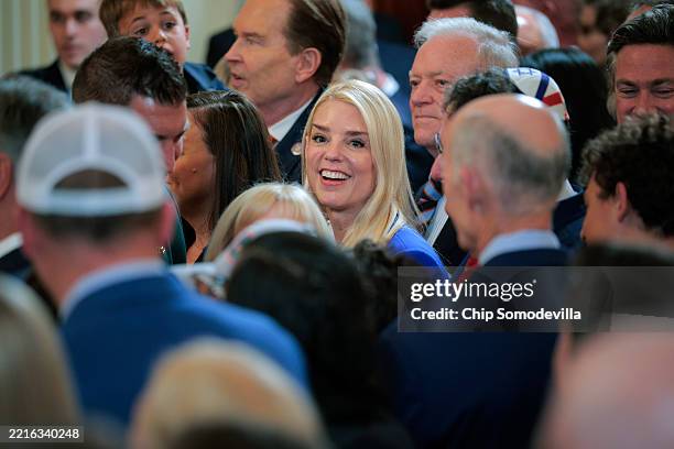 Attorney General Pam Bondi greets guests during a celebration of the 2025 NCAA men's basketball Champion Florida Gators in the East Room of the White...