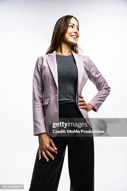 studio portrait of businesswoman smiling on white background - igualdad de género fotografías e imágenes de stock
