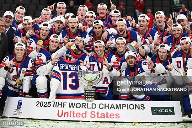 Team celebrates with the throphy after winning gold during the overtime of the IIHF Men's Ice Hockey World Championship final match between...