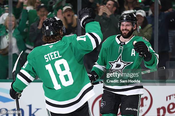Tyler Seguin of the Dallas Stars congratulated by Sam Steel after scoring a goal against the Edmonton Oilers during the third period in Game One of...