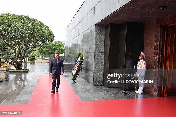 France's President Emmanuel Macron takes part in a wreath-laying and tribute-paying ceremony at the Ho Chi Minh Mausoleum in Hanoi on May 26, 2025.