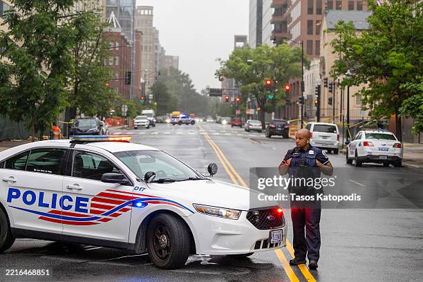 Police and Investigators work at the crime scene, where two Israeli Embassy staff members were killed yesterday evening outside an event at the...