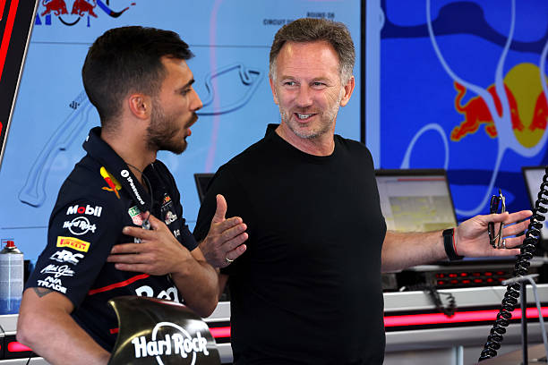 Christian Horner, Team Principal of Oracle Red Bull Racing talks with a teammate in the garage during previews ahead of the F1 Grand Prix of Monaco...
