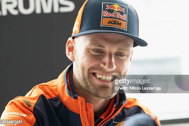 Brad Binder of South Africa and Red Bull KTM Factory Racing smiles with journalists during the media scrums in media center during the MotoGP Of...