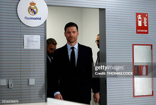 Newly appointed Real Madrid's coach Xabi Alonso arrives to give a press conference during his official presentation at Real Madrid Sports City in...
