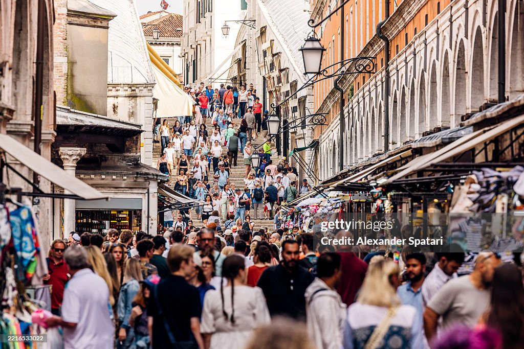 Crowds of tourists on Rialto Bridge, Venice, Veneto, Italy