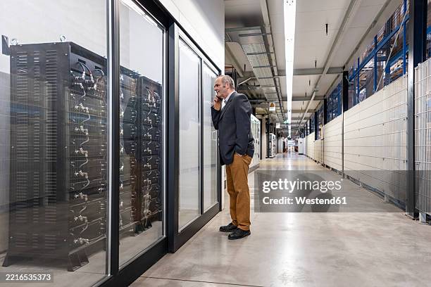 manager inspecting server room in a production hall - old server room stock pictures, royalty-free photos & images