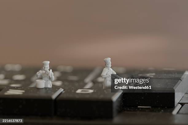 miniature chefs working on a keyboard in a creative 3d scene - small kitchen stock illustrations