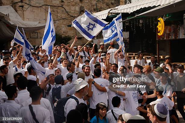 Jewish right wing activists march in the Muslim quarter of Jerusalem's old city as part of Jerusalem Day on May 26, 2025 in Jerusalem. The...