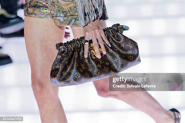 Model, handbag detail, walks the runway during the Louis Vuitton Cruise 2026 at Palais Des Papes on May 22, 2025 in Avignon, France.