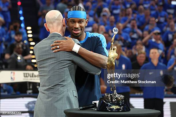 Commissioner of the NBA Adam Silver presents Shai Gilgeous-Alexander of the Oklahoma City Thunder with the MVP Michael Jordan Trophy prior to a game...