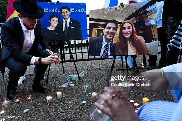 Mourners lights candles during a vigil outside of the White House on May 22, 2025 in Washington, DC. The vigil is held for the victims of the Capital...