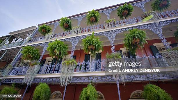 ornate balconies on building in new orleans - new orleans stock pictures, royalty-free photos & images