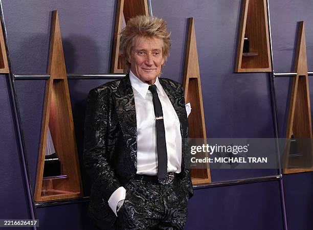 British singer songwriter Rod Stewart, recipient of this year's Lifetime Achievement Award, arrives for the 51st American Music Awards at the...