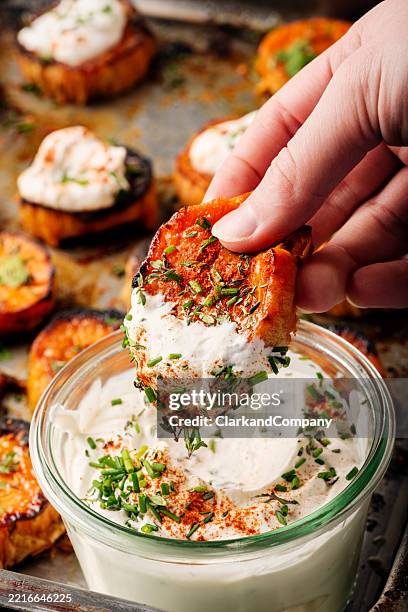 butter roasted sweet potato slices. - sour cream stock pictures, royalty-free photos & images