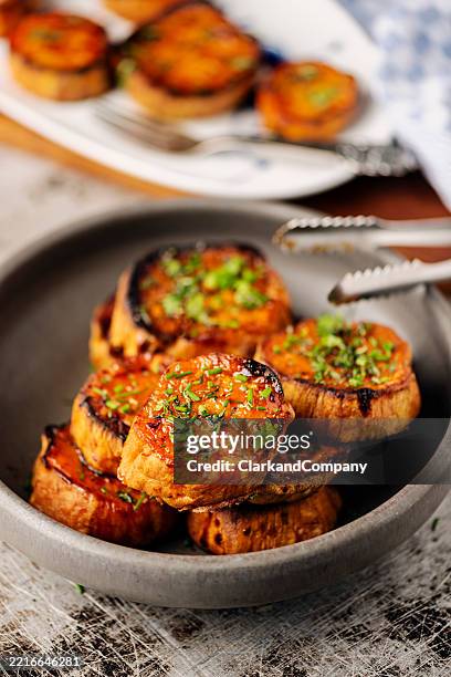 butter roasted sweet potato slices. - sour cream stock pictures, royalty-free photos & images