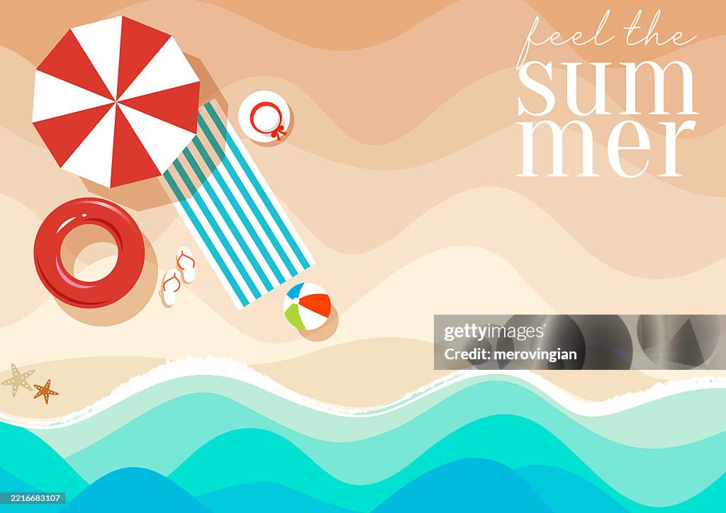 Aerial view of summer beach, blue ocean warm sands with accessories and parasol