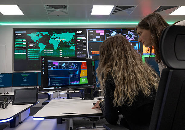 May 2025, Hesse, Darmstadt: Two employees sit at monitors in the new Cyber Security Operations Center at Esa. The European Space Agency’s new cyber... May 2025, Hesse, Darmstadt: Two employees sit at monitors in the new Cyber Security Operations Center at Esa. The European Space Agency’s new cyber...