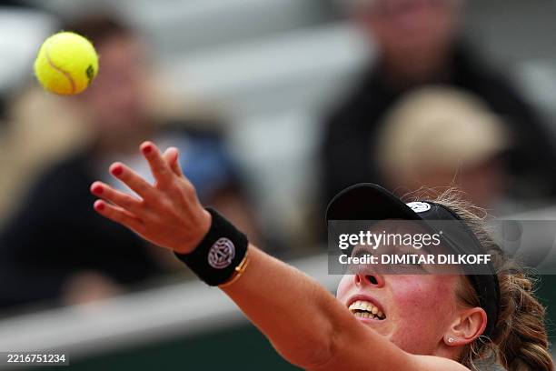 Poland's Magdalena Frech serves to Tunisia's Ons Jabeur during their women's singles match on day 3 of the French Open tennis tournament on Court...
