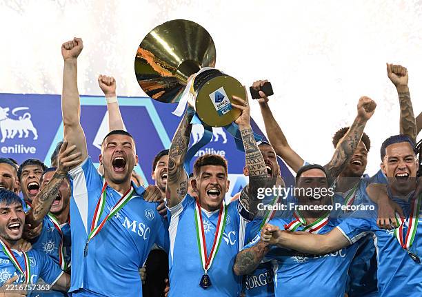 Giovanni Di Lorenzo of Napoli lifts the Serie A TIM Scudetto title trophy after his team's victory in the Serie A match between Napoli and Cagliari...
