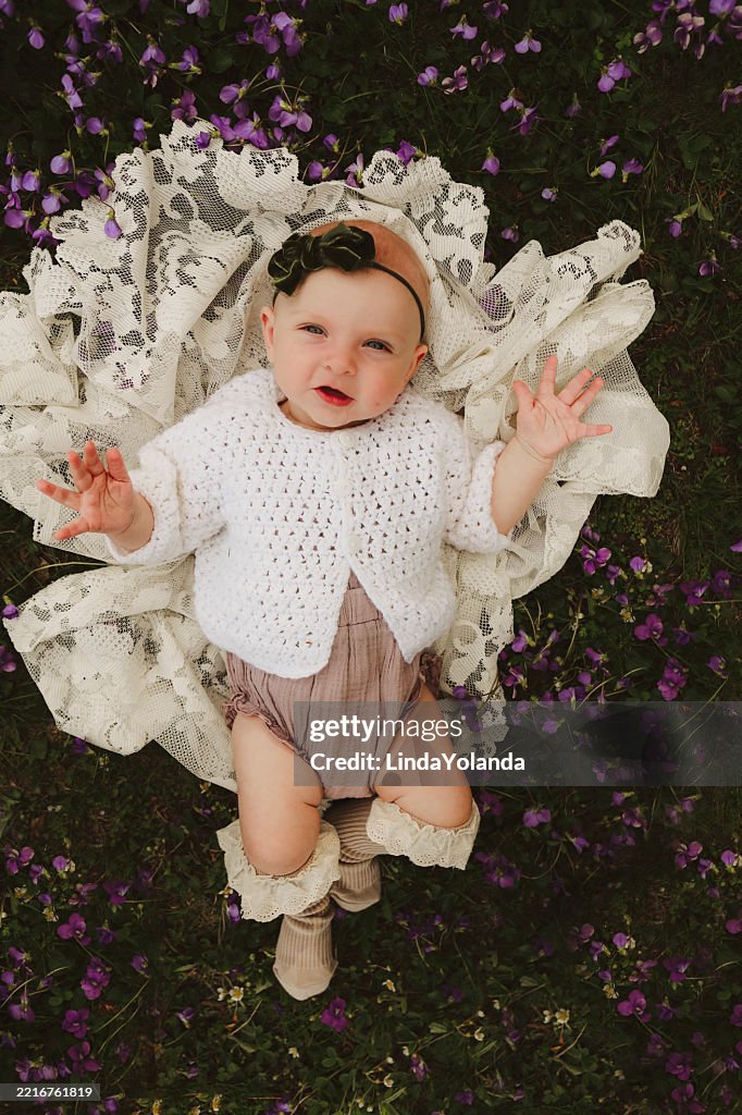 Baby Girl in Patch of Violets
