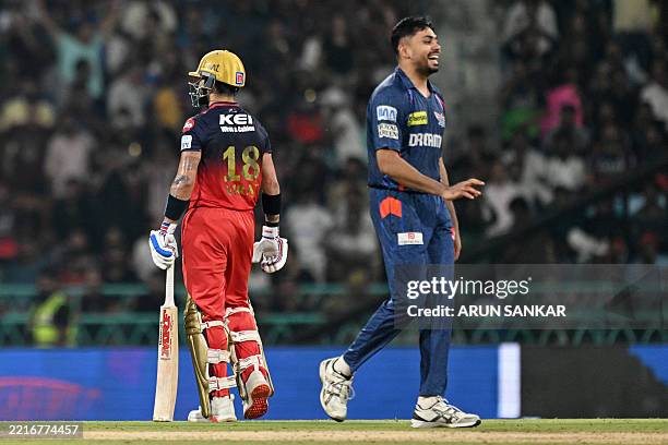 Lucknow Super Giants' Avesh Khan celebrates after taking the wicket of Royal Challengers Bengaluru's Virat Kohli during the Indian Premier League...