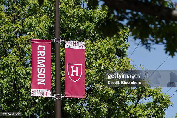 The Harvard Crimson sports crest on banners at the Harvard University Athletics Complex in Boston, Massachusetts, US, on Tuesday, May 27, 2025....