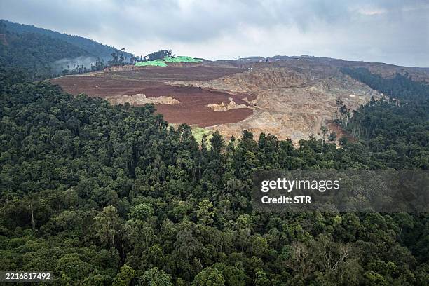 This aerial photo taken on April 16, 2025 shows a general view of a nickel mining site and the edge of the forest where Bokum, a member of the...