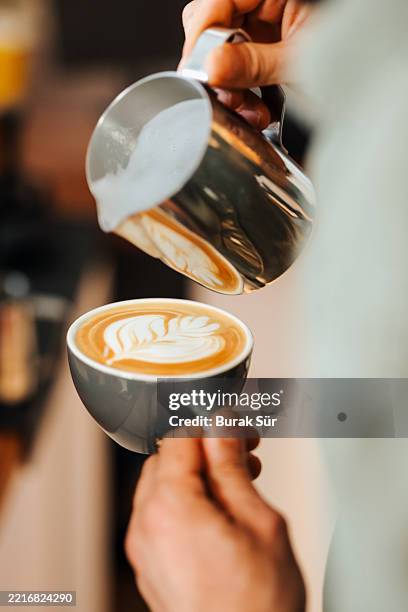 latte making barista, small business - barista stockfoto's en -beelden